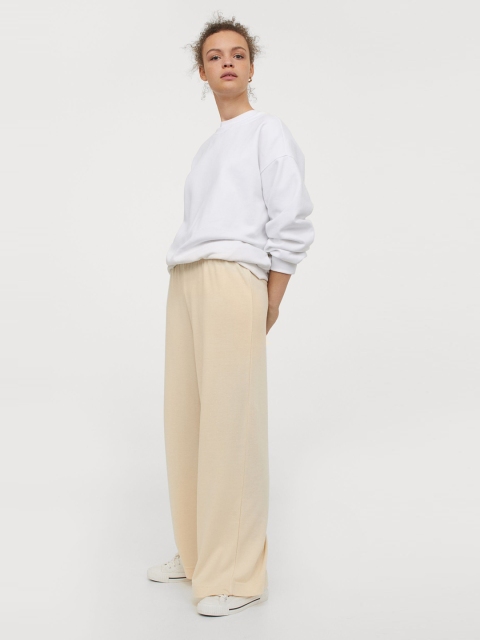 

H&M Women Yellow Solid Straight Jersey Trousers