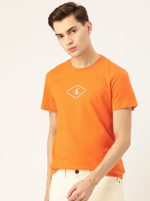 

Calvin Klein Jeans Men Orange & White Brand Logo Pure Cotton T-shirt