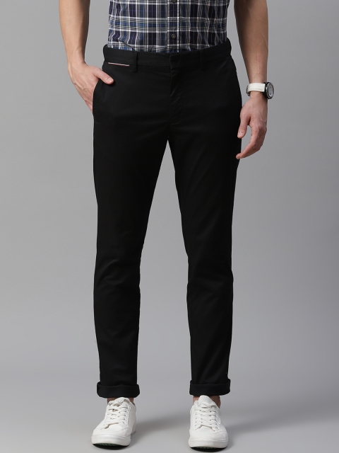 

Tommy Hilfiger Men Black Solid Slim Fit Regular Trousers