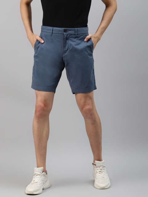 

Tommy Hilfiger Men Blue Mid-Rise Regular Shorts