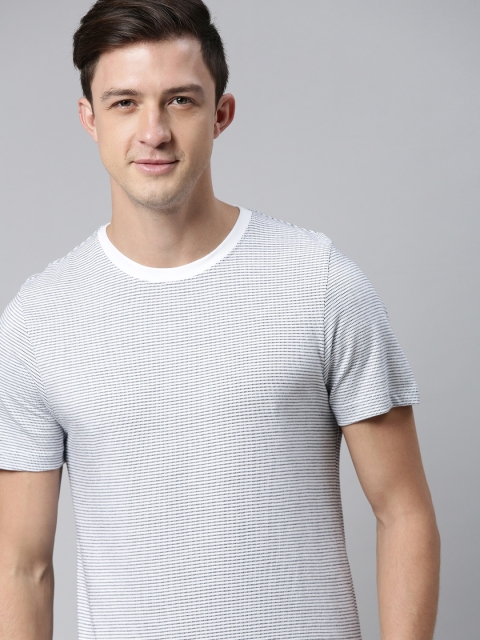 

Mast & Harbour Men White & Navy Blue Self Design T-shirt
