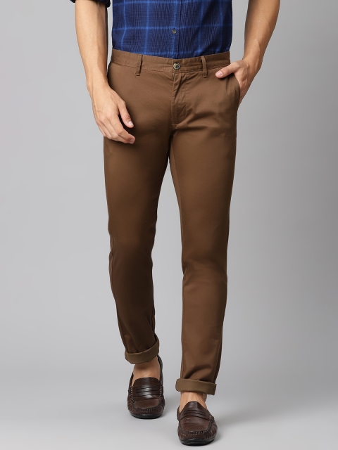

Indian Terrain Men Brown Solid Slim Fit Regular Trousers