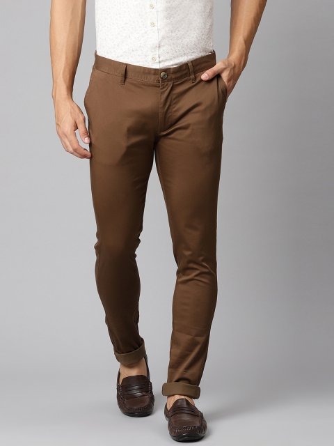 

Indian Terrain Men Brown Solid Slim Fit Regular Trousers