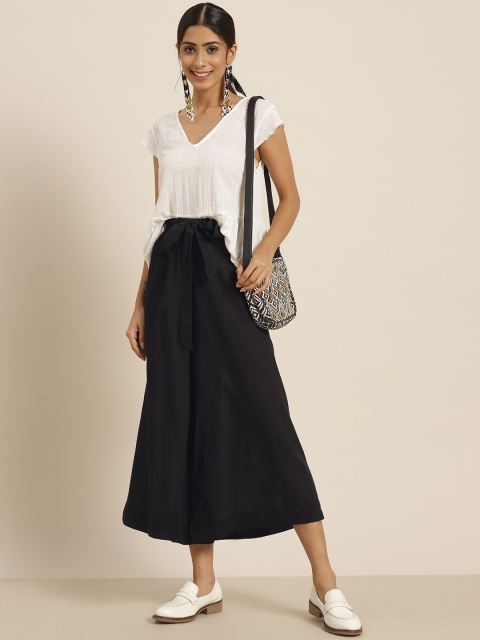 

Sangria Women Black Solid Flared Pure Cotton Cropped Palazzos