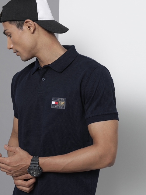 

Tommy Hilfiger Men Navy Blue Self Design Polo Collar T-shirt with Applique