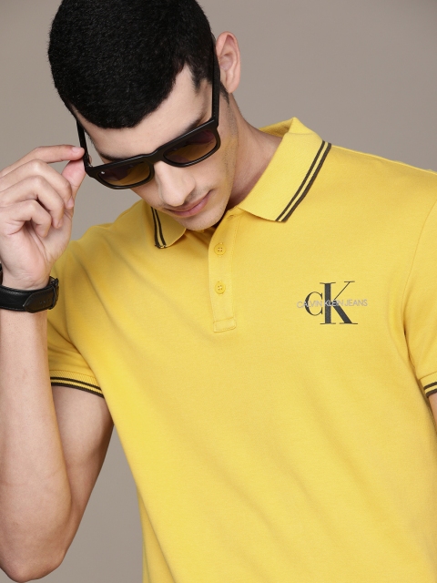 

Calvin Klein Jeans Men Yellow Logo Printed Polo Collar Slim Fit Cotton Casual T-shirt