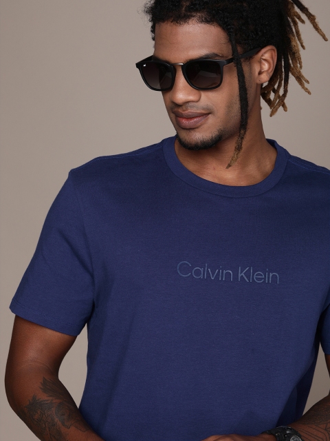 

Calvin Klein Jeans Men Navy Blue Brand Logo Printed T-shirt