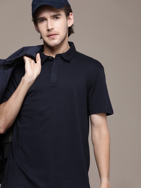 

Calvin Klein Jeans Men Navy Blue Solid Pure Cotton Polo Collar T-shirt