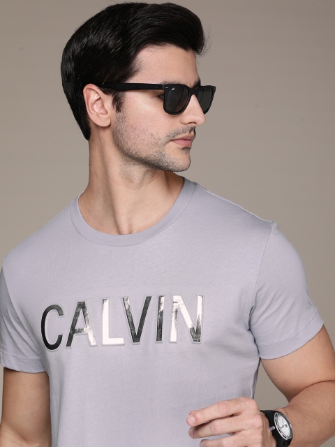 

Calvin Klein Jeans Men Grey Brand Logo Embossed Pure Cotton T-shirt