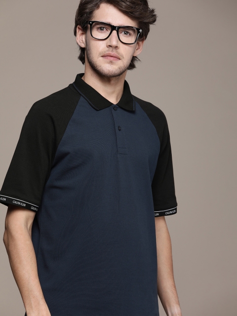 

Calvin Klein Jeans Men Navy Blue Solid Polo Collar T-shirt