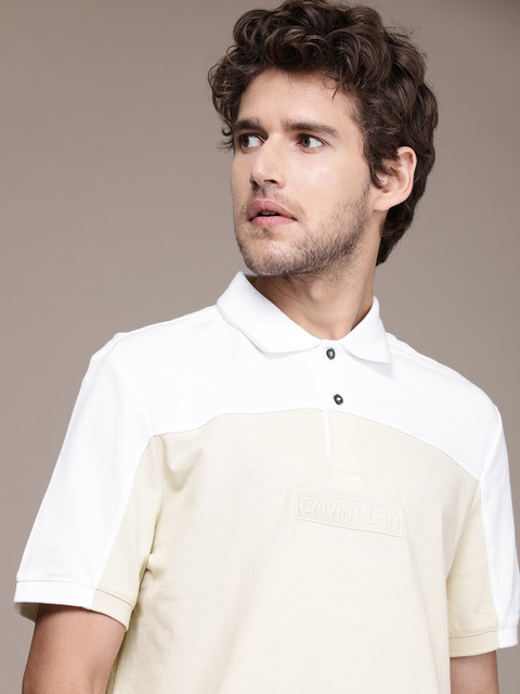 

Calvin Klein Jeans Men White & Beige Brand Logo Printed Polo Collar Pure Cotton T-shirt