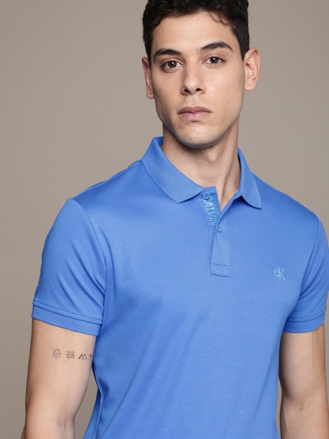 

Calvin Klein Jeans Men Blue Printed Polo Collar Slim Fit T-shirt