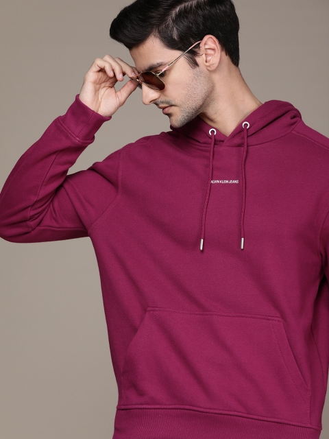

Calvin Klein Jeans Men Magenta Solid Hooded Sweatshirt