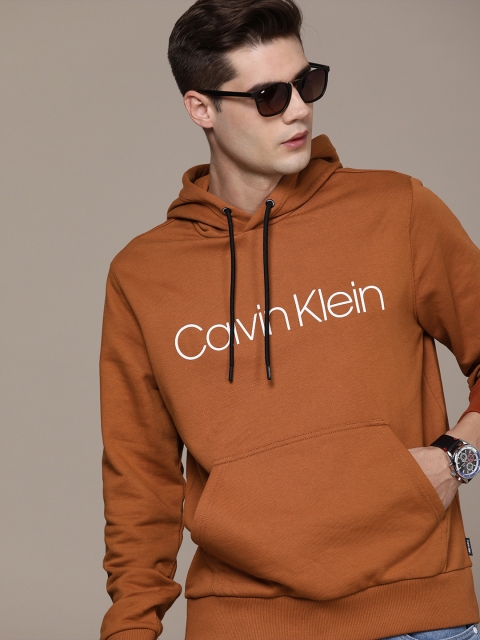 

Calvin Klein Jeans Men Rust Orange Printed Organic Cotton Hooded Sweatshirt