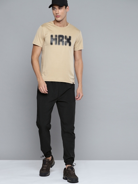 

HRX By Hrithik Roshan Outdoor Men Jet Black Lycra Brand Carrier Tracksuits