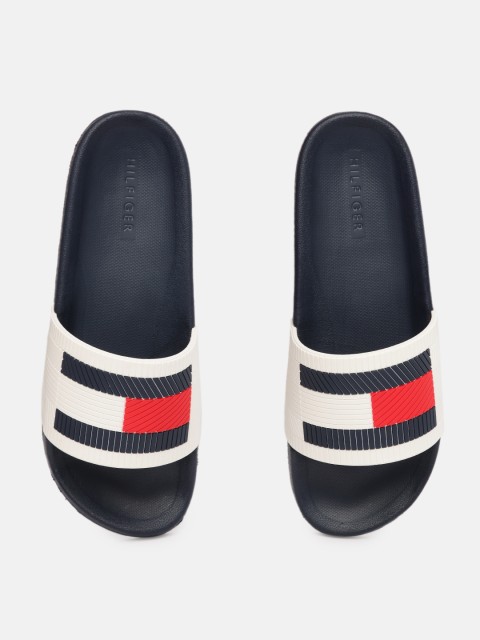 

Tommy Hilfiger Men Blue and White Self Design Sliders