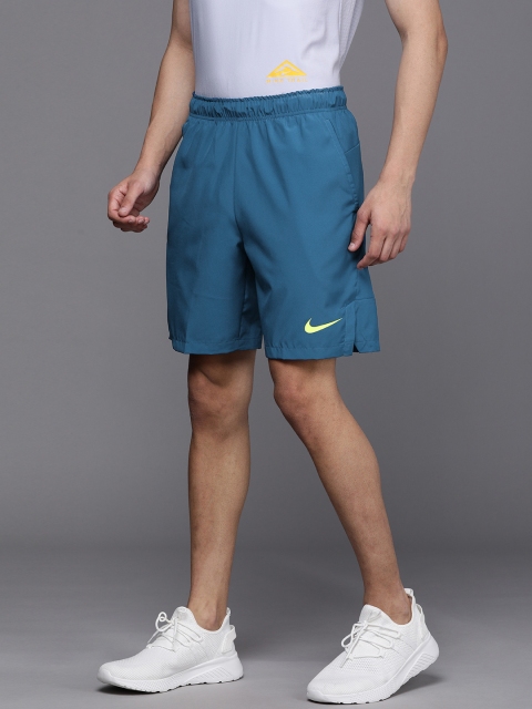 

Nike Men Blue Solid Mid-Rise Sports Shorts