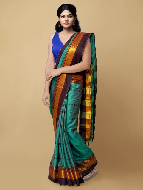 

Unnati Silks Women Green & Maroon Dabu Printed Sico Handloom Saree