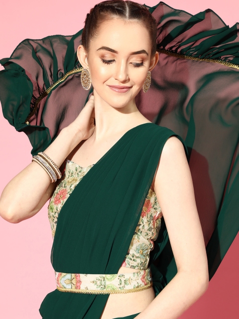 

Inddus Green Solid Ruffled Saree With Embroidered Blouse