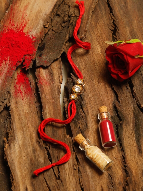 

Ruby Raang Gold & Red Kundan Rakhi Gift Box With Roli, Chawal & Greeting Card