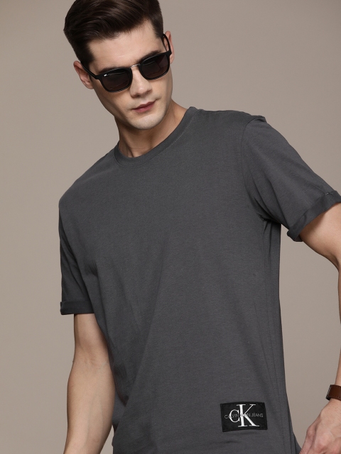 

Calvin Klein Jeans Men Grey Solid Pure Cotton T-shirt