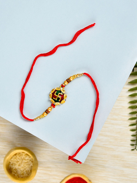 

Zaveri Pearls Men Red & Green Enamelled Swastik Rakhi With Chawal Roli