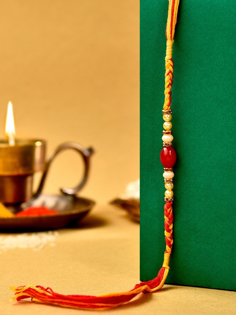 

Zaveri Pearls Red Beads Embellished Rakhi With Chawal Roli