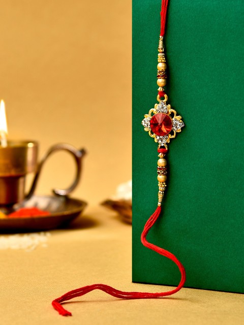 

Zaveri Pearls Men Red Stone Embellished Rakhi With Chawal Roli