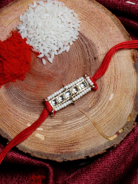 

Shoshaa Gold-Toned & Red Kundan With Beads Studded Bhai Rakhi