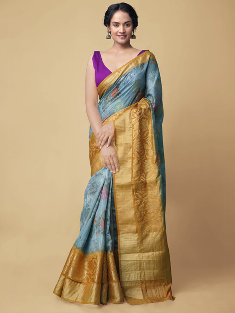

Unnati Silks Blue & Gold-Toned Floral Embroidered Silk Cotton Banarasi Handloom Saree