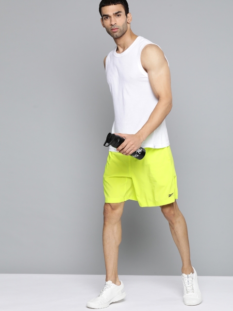 

Reebok Men Yellow Solid Sports Regular Shorts, Green