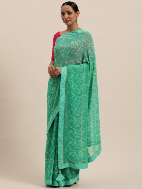 

Triveni Sea Green & White Ethnic Motifs Pure Georgette Saree