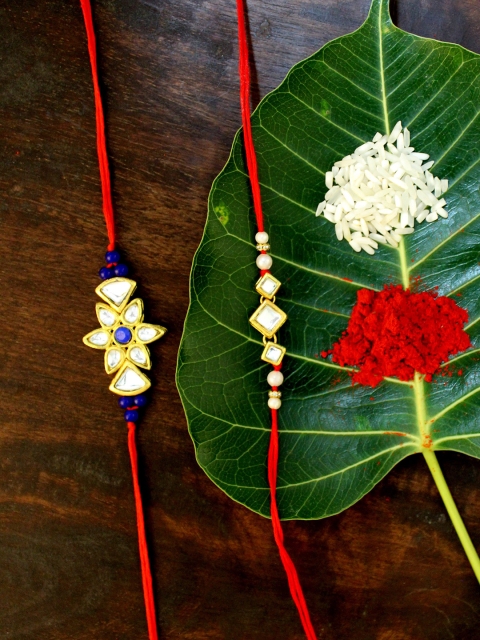 

KARATCART Set of 2 Gold-Plated & Red Kundan Rakhi