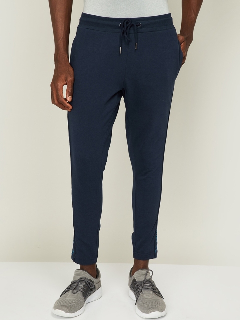

SmileyWorld Men Navy Blue & Blue Solid Cotton Track Pants