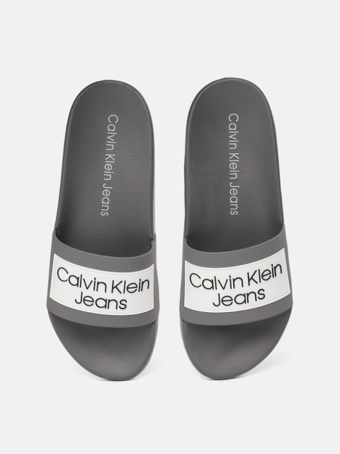 

Calvin Klein Men Grey & White Printed Sliders