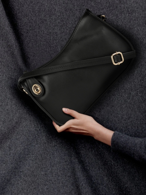 

Mast & Harbour Black Solid Synthetic Leather Regular Structured Sling Bag