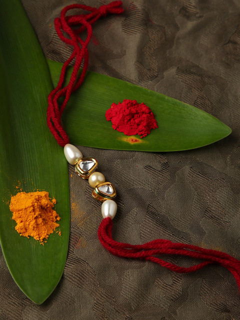

Sepia Gold Toned & Red Kundan Rakhi