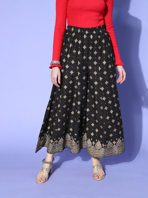 

Sangria Women Black & Golden Ethnic Motifs Printed Flared Ethnic Pure Cotton Palazzos