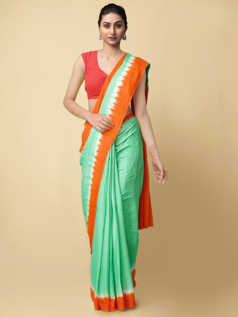 

Unnati Silks Green & Orange Leheriya Pure Cotton Dabu Sustainable Saree