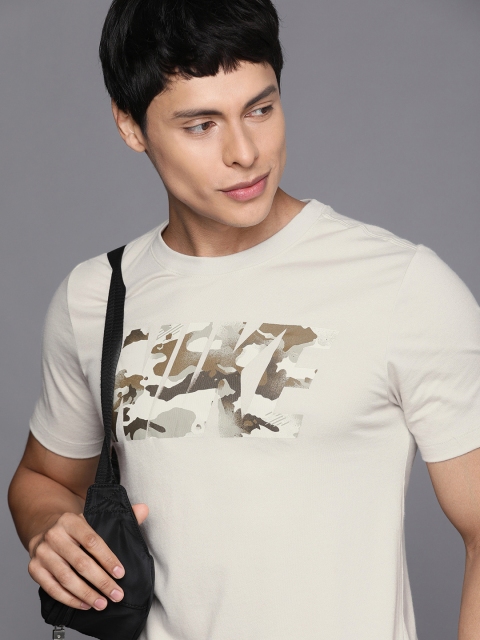 

Nike Men Beige & Brown Printed T-shirt