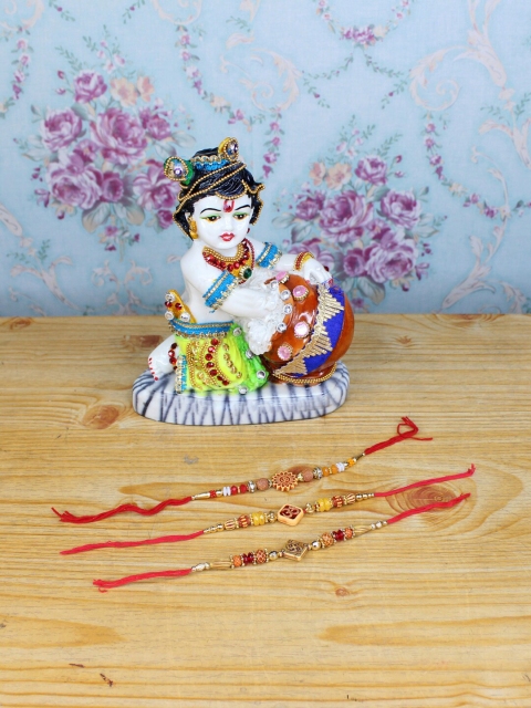 

Wonderland White & Red Set Of 3 Rakhi With Bal Gopal Showpiece