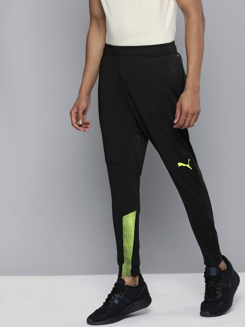 

Puma Men Black & Fluroscent Green Brand Logo Printed DryCell Slim Fit Training Track Pants