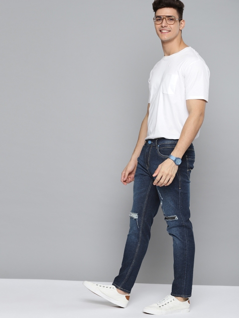 

Mast & Harbour Men Navy Blue Carrot Mildly Distressed Light Fade Stretchable Jeans