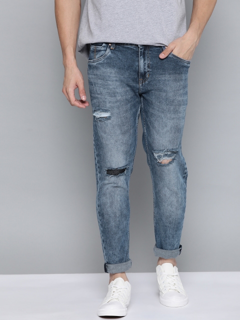 

Mast & Harbour Men Blue Carrot Mildly Distressed Light Fade Stretchable Jeans