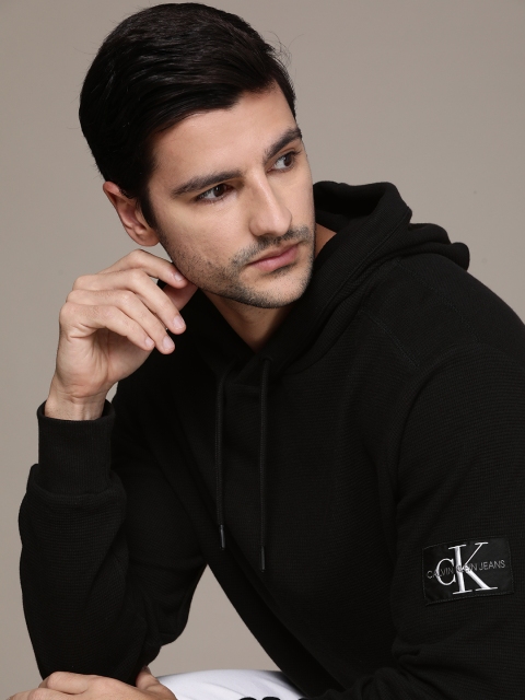 

Calvin Klein Jeans Men Black Solid Hooded Sweatshirt