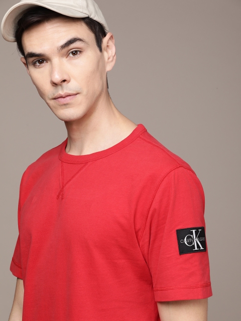 

Calvin Klein Jeans Men Solid Red Pure Cotton T-shirt