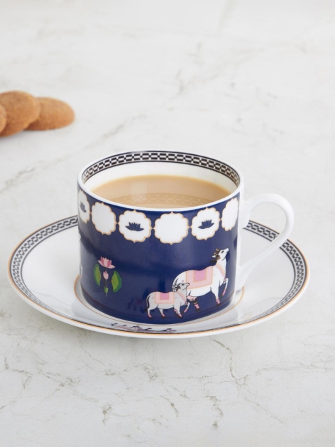 

Home Centre Blue & White Cow and Calf Cup and Saucer- Bone China- 250 ml