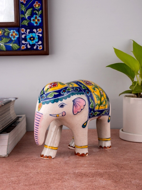 

Neerja White & Blue Handpainted Jaipur Blue Pottery Elephant Showpiece