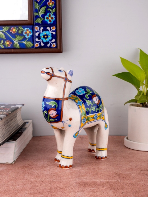 

Neerja Blue & White Handpainted Jaipur Blue Pottery Camel Showpiece