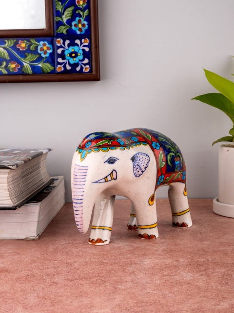 

Neerja Off-White & Blue Handpainted Jaipur Blue Pottery Elephant Showpiece